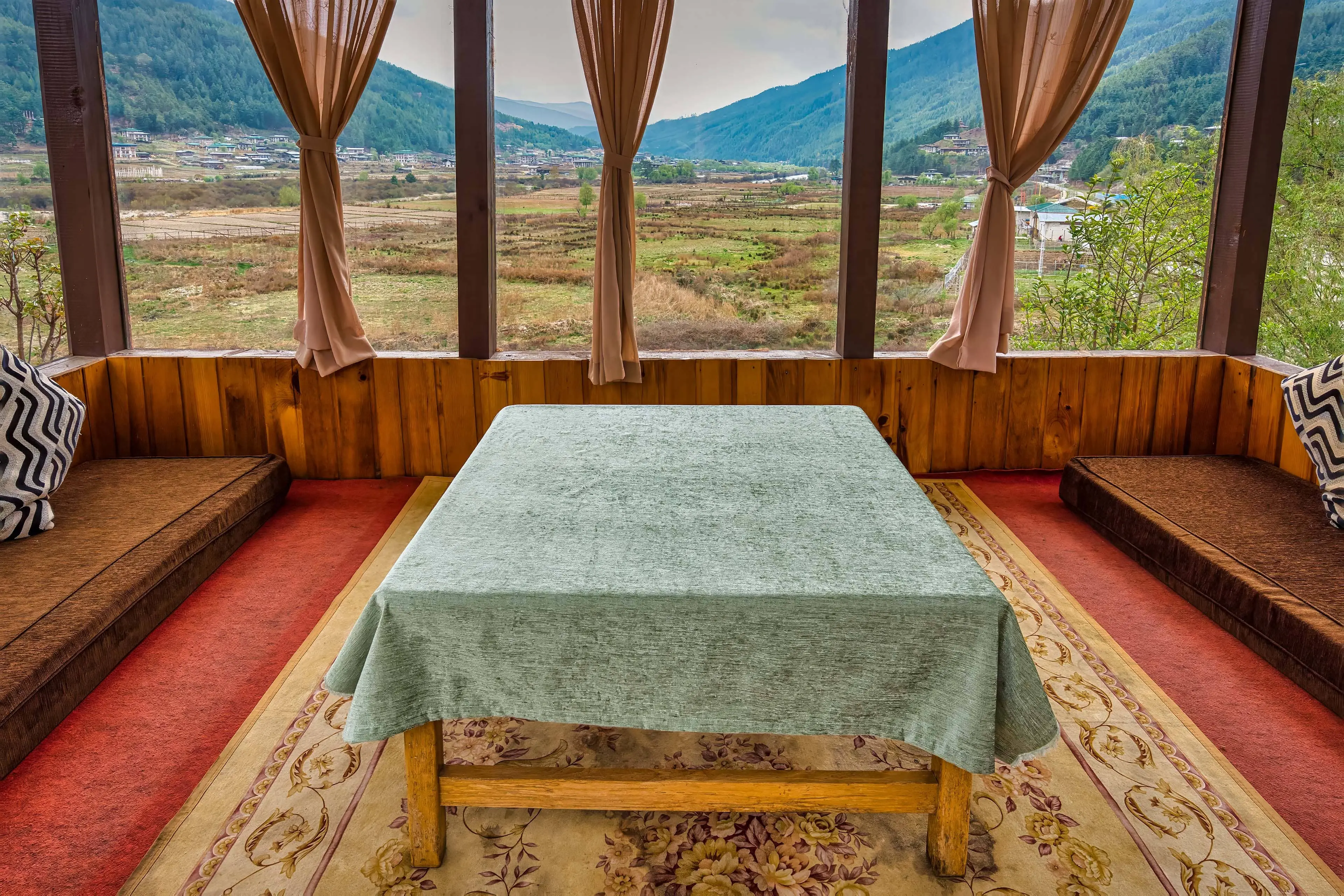 Sitting area in the glass house and the view from the room