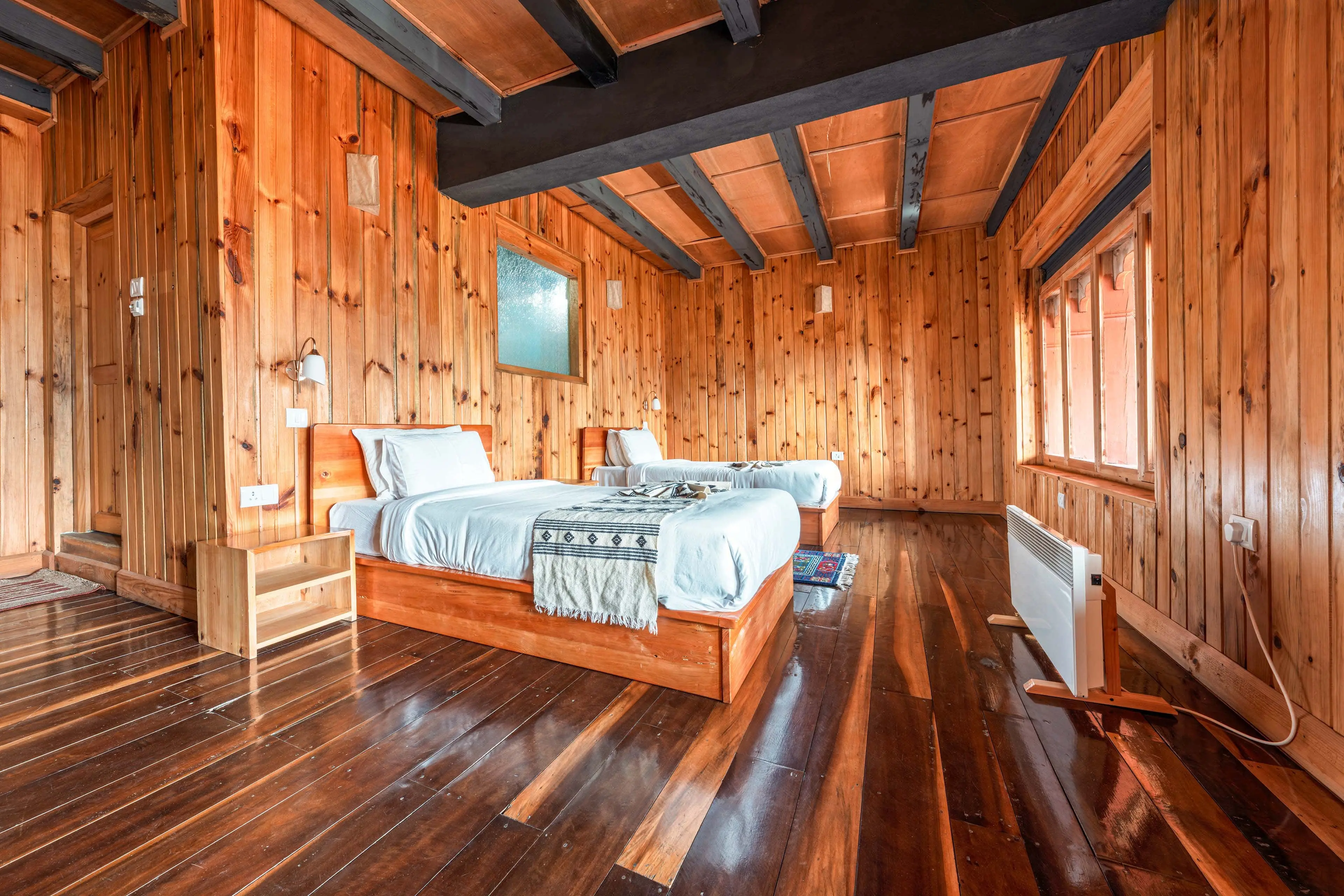 A corner shot of the bedroom in Room 203