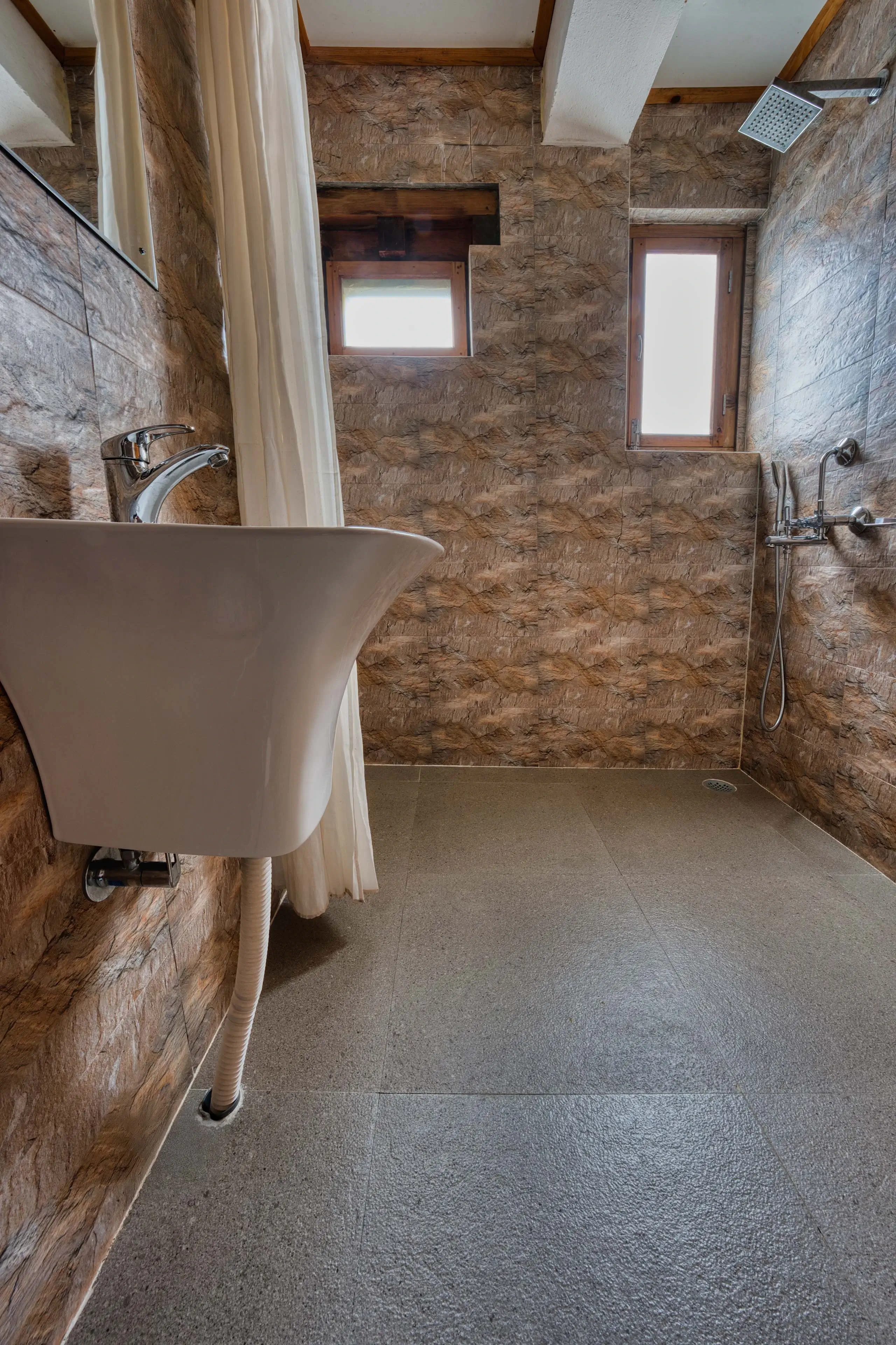 View of the shower area in Room 207 bathroom